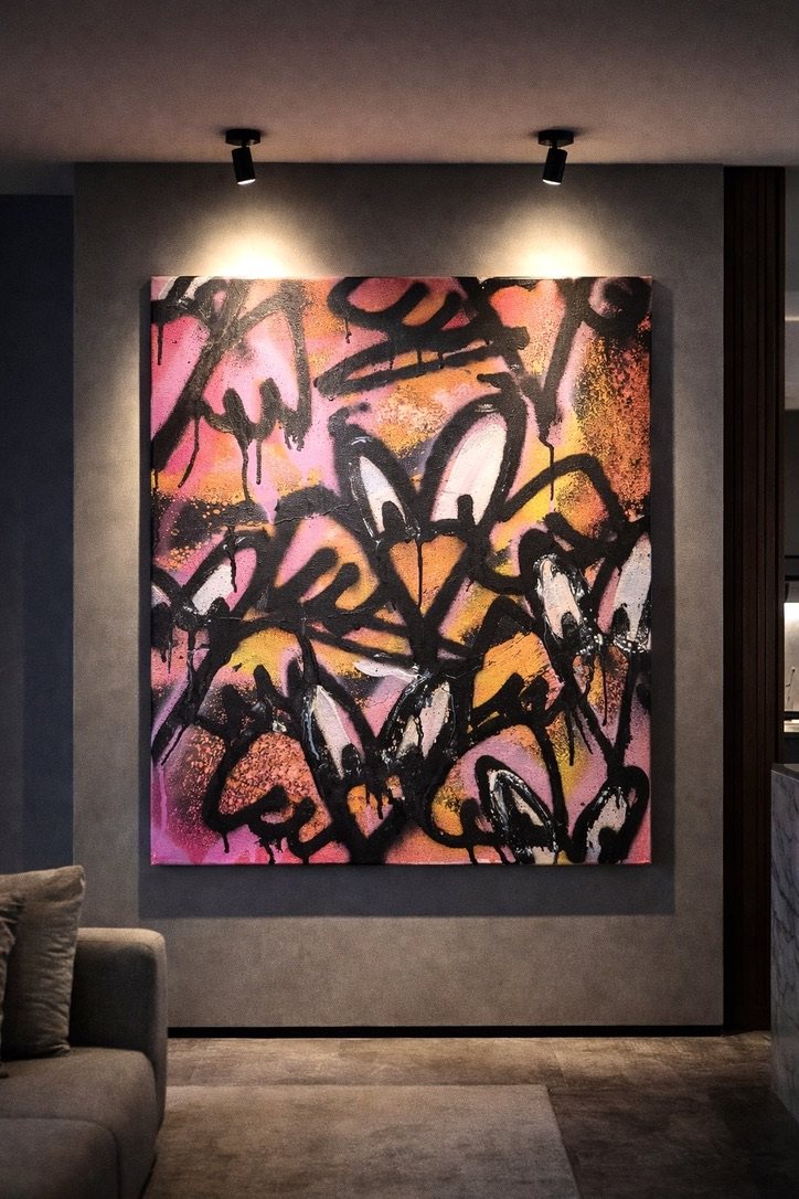 Pink and orange layered hearts on a grey plaster wall