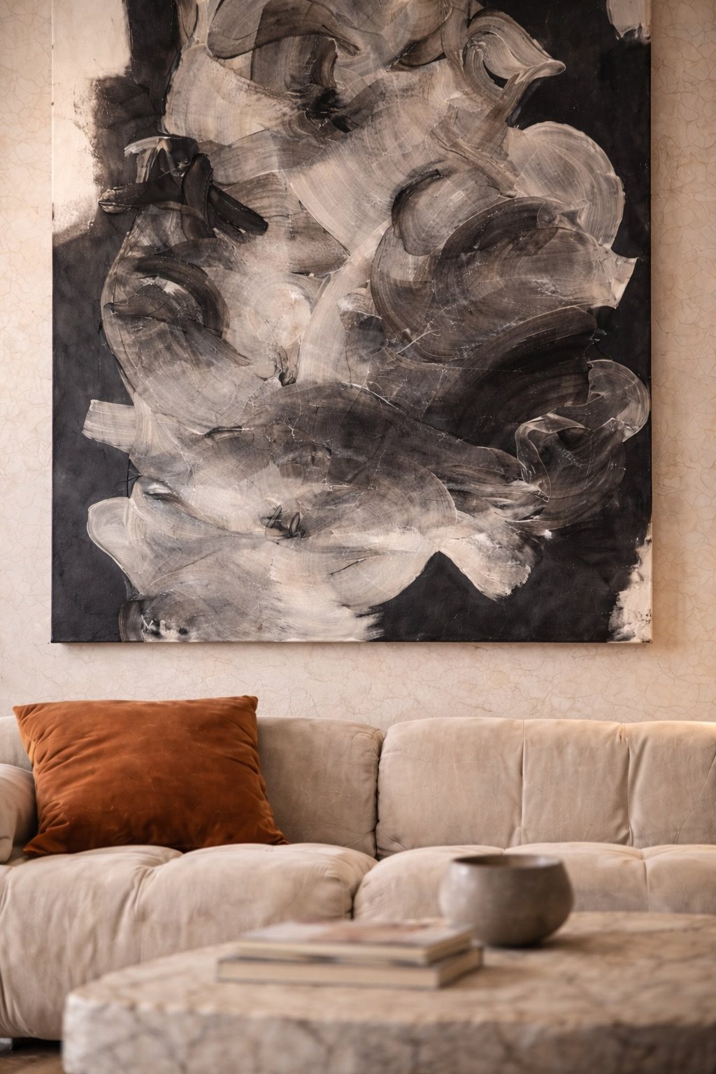 Close view of the black and white painting above the sofa